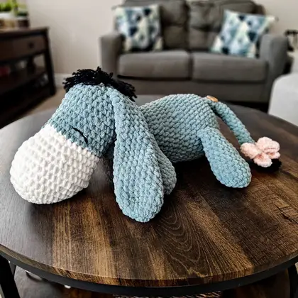 Close view of Eeyore's face and long grey ears