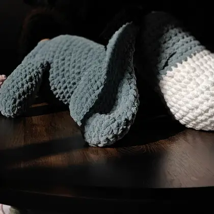 Eeyore lying down with legs stretched forward