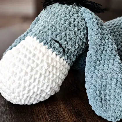 Detail of Eeyore's pink muzzle and embroidered nostrils