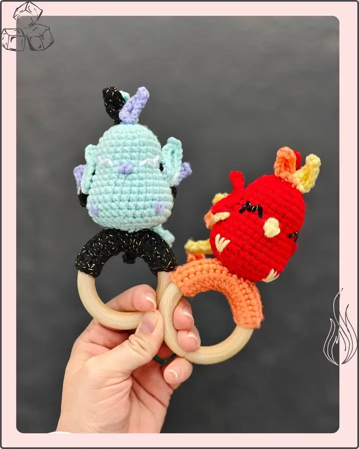 Felix the Phoenix, a crocheted phoenix in flame oranges, reds and golds with a long tail