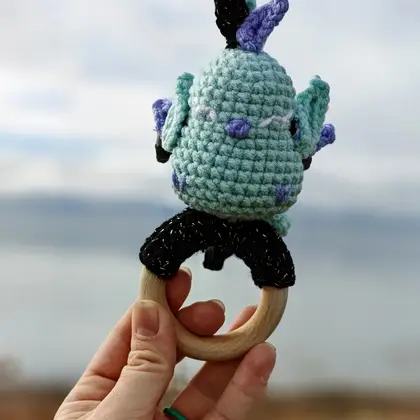 Felix the Phoenix held to show scale